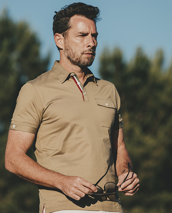 Modern gentleman with sporty khaki polo shirt in retro design
